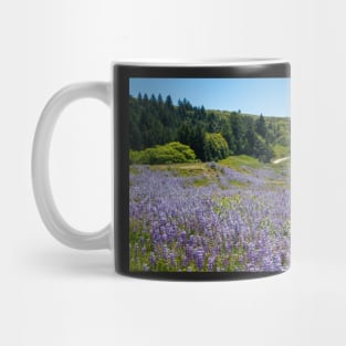 Lupine flowers on a hillside Mug